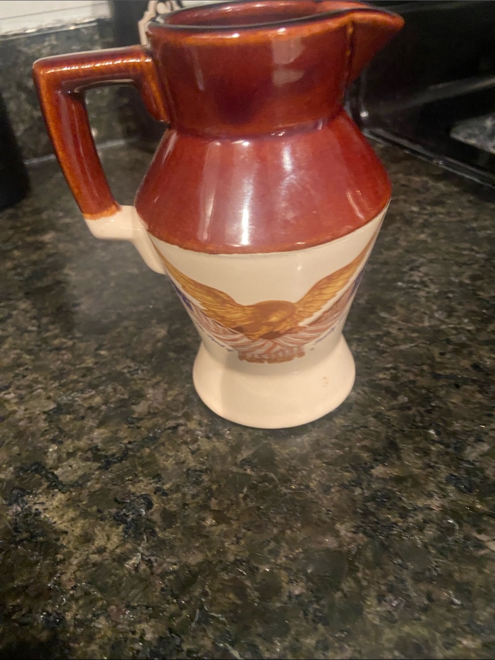 Brown and Cream Ceramic Pitcher with Eagle Motif
